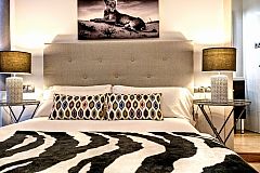 Romantic & Wild designer master "safari lodge" bedroom in La Rambla at the Parsifal apartment for rent short term in Barcelona